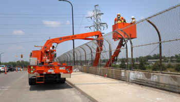 MDOT Big Bridge Scoping. Reach-All extends over side of bridge for inspection.